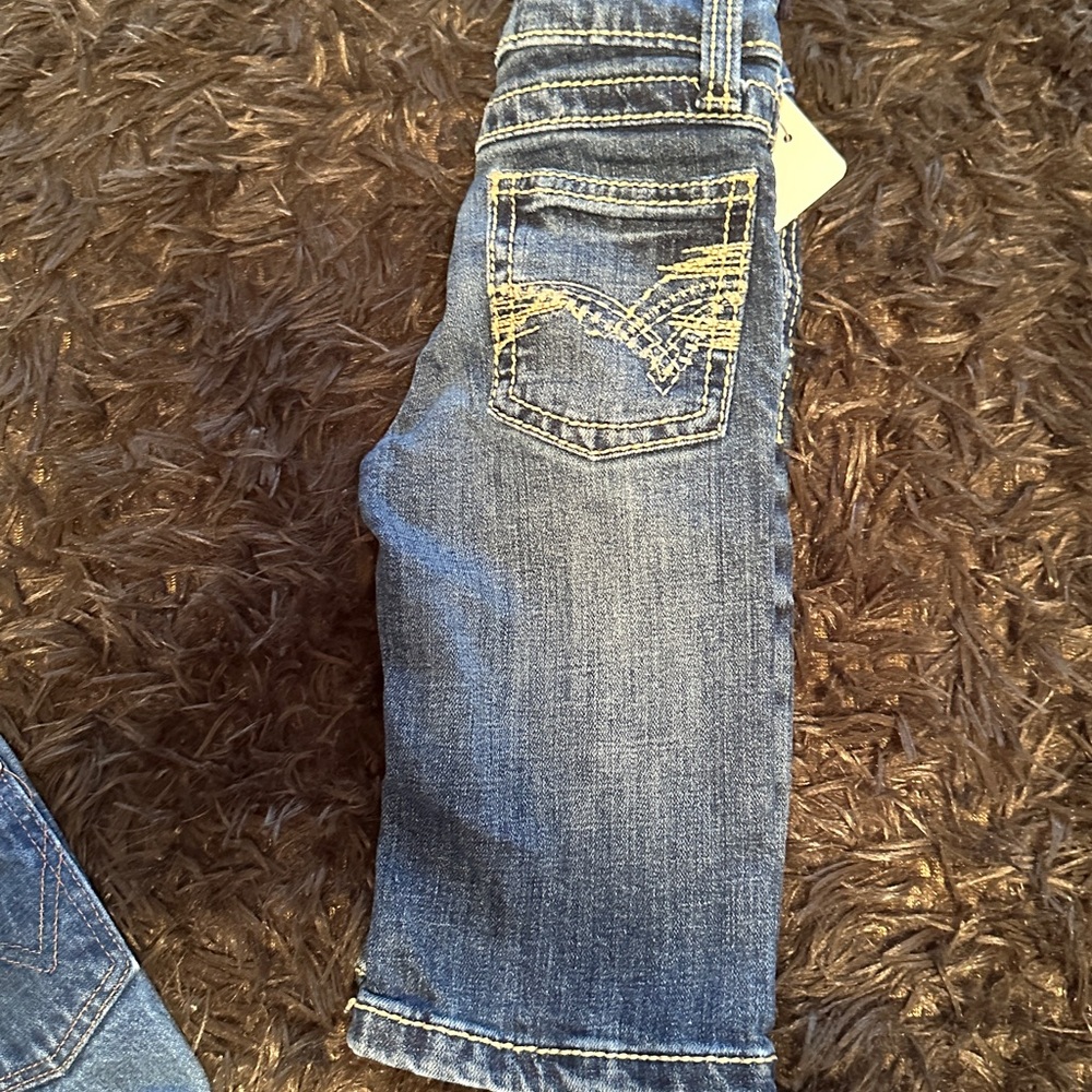 Twenty x infants size 1t with adjustable waist.